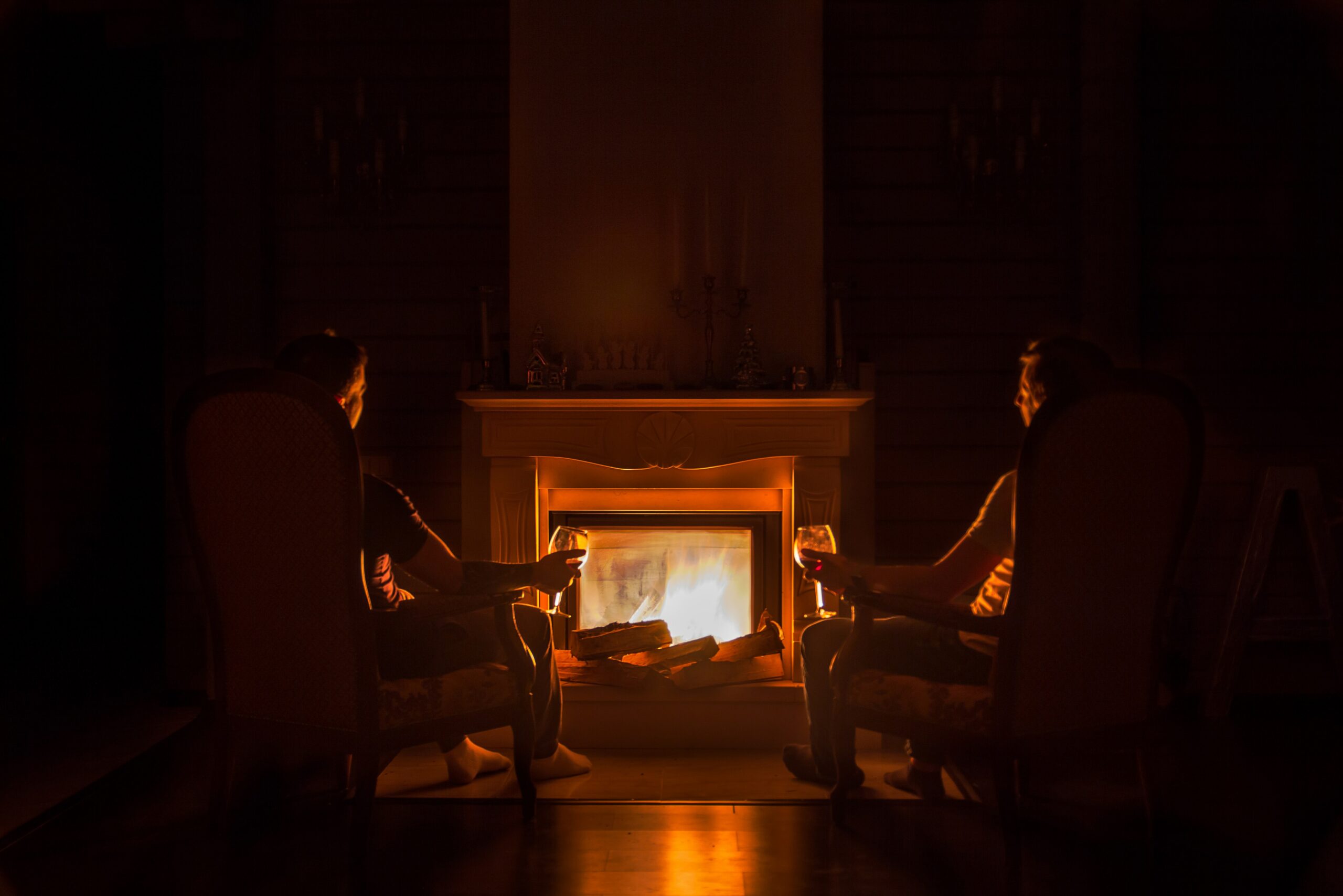 family sitting by kiln-dried log fire