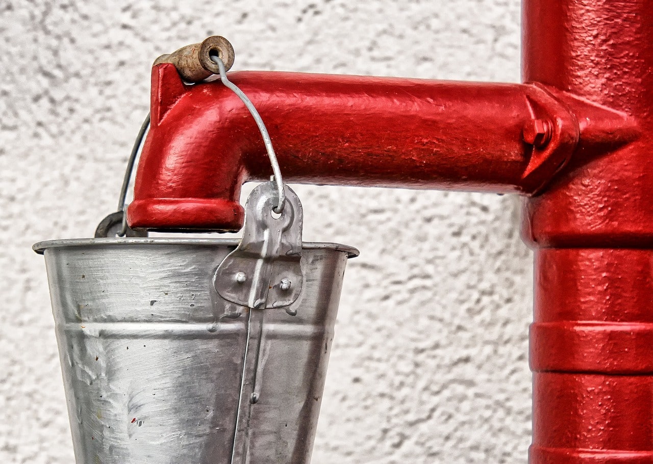 Picture of bucket being filled with water 